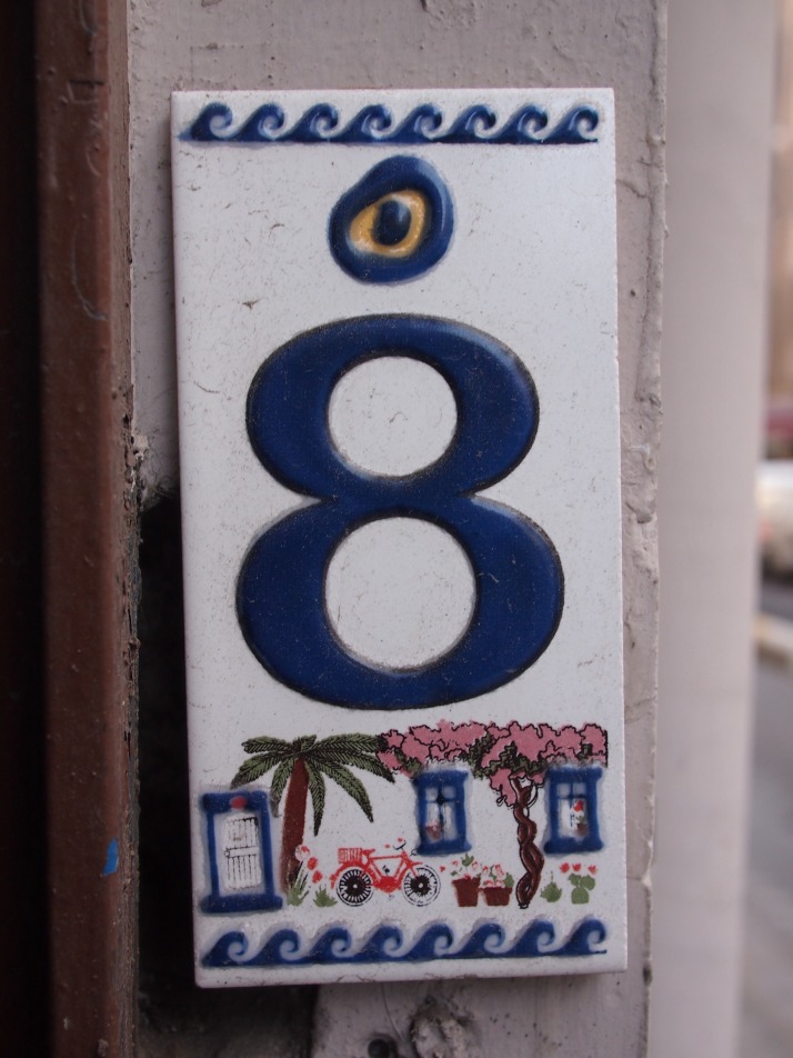 Evil eye on house number plate