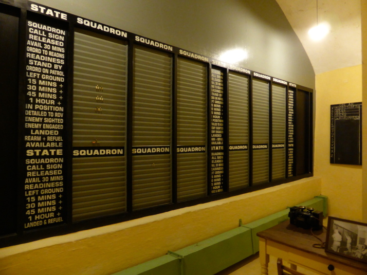 The defensive squadron situation room sits behind the squadron board shown in the last photo above - it's a series of slats that the operators on this side update with little metal tags as new information comes in