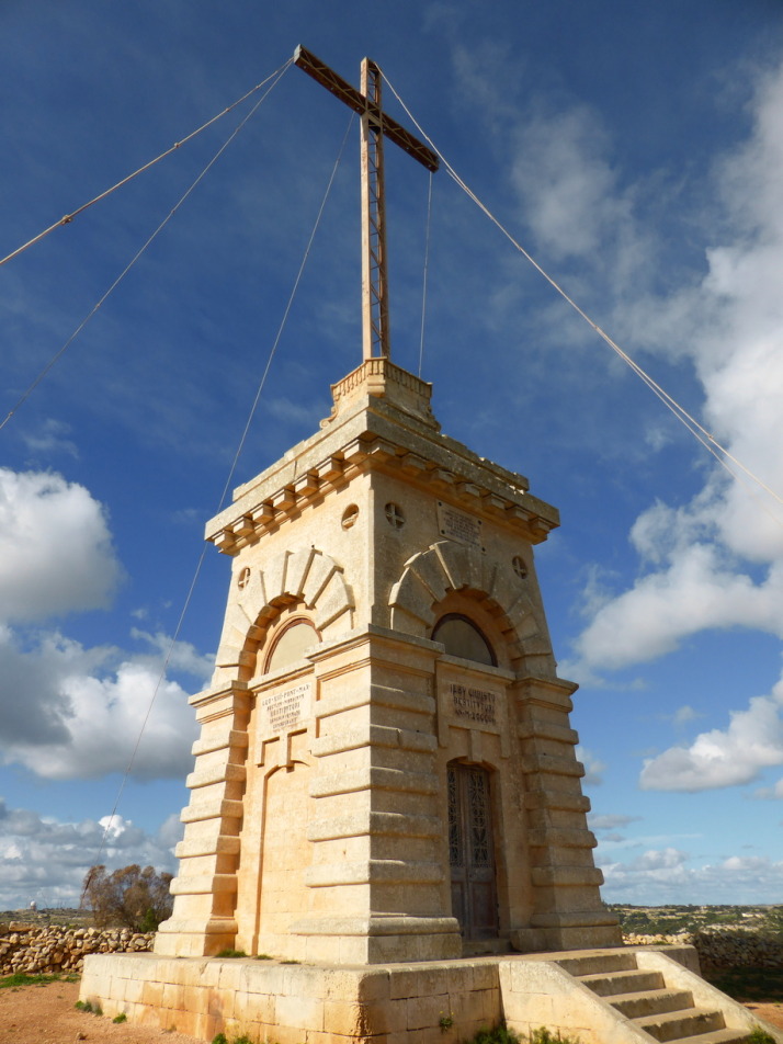 The huge bronze Laferla Cross next to the Assumption Church sits on the edge of the hill with lovely views over the second half of the walk